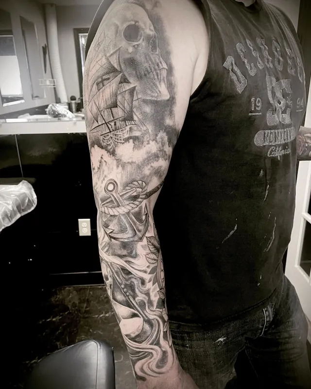 Alternate view of a nautical arm sleeve with a sailing ship, skulls and tentacles.